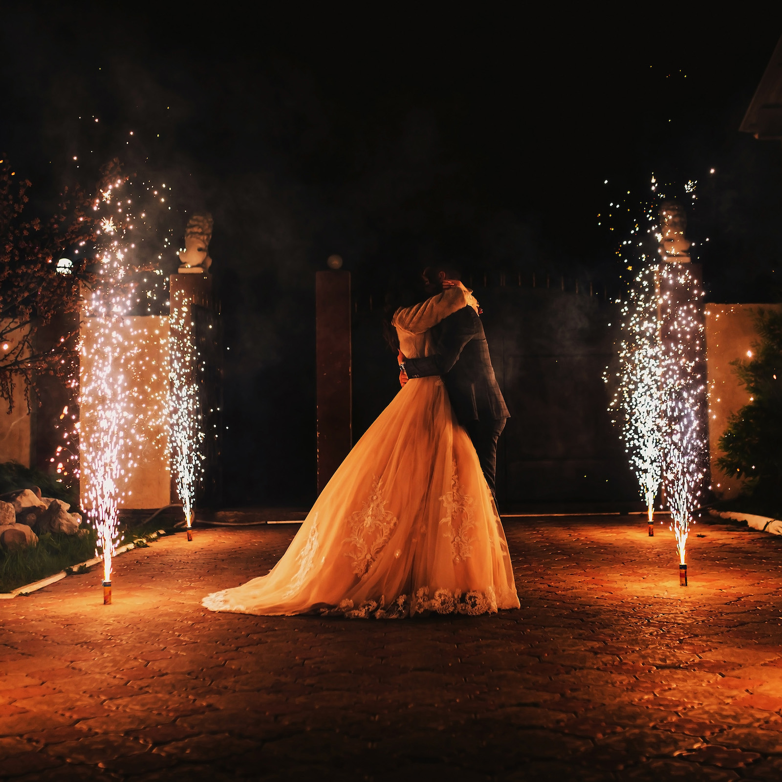 Newlyweds,Kiss,On,The,Background,Of,A,Pyrotechnic,Show,,Fireworks